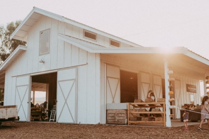 a group of people standing in front of a house