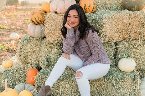 a woman holding a teddy bear